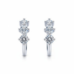 Sterling silver huggie hoop earrings with three round moissanite stones