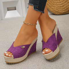 Peep-toe wedge sandals with purple fabric uppers and braided platform wedges