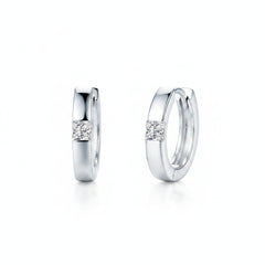 925 sterling silver huggie earrings with a round moissanite stone on the front