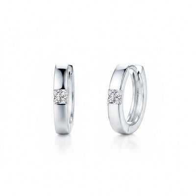925 sterling silver huggie earrings with a round moissanite stone on the front