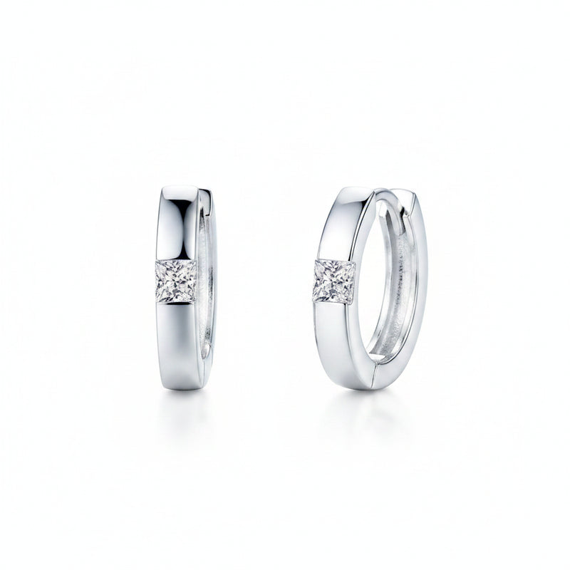925 sterling silver huggie earrings with a round moissanite stone on the front