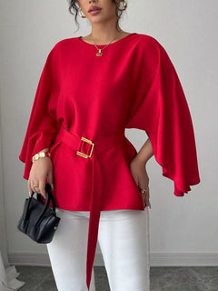 Red batwing-sleeve belted blouse, draped sleeves and square waist buckle