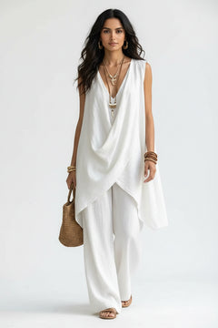 Sleeveless asymmetrical top and wide-leg pants set in white, draped crossover front