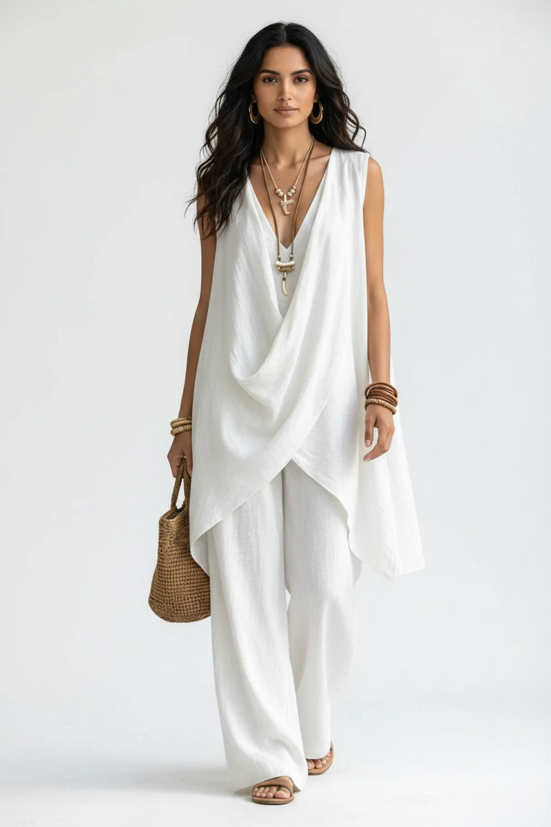 Sleeveless asymmetrical top and wide-leg pants set in white, draped crossover front