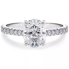 Sterling silver ring with oval center stone and pavé band detail, prong set