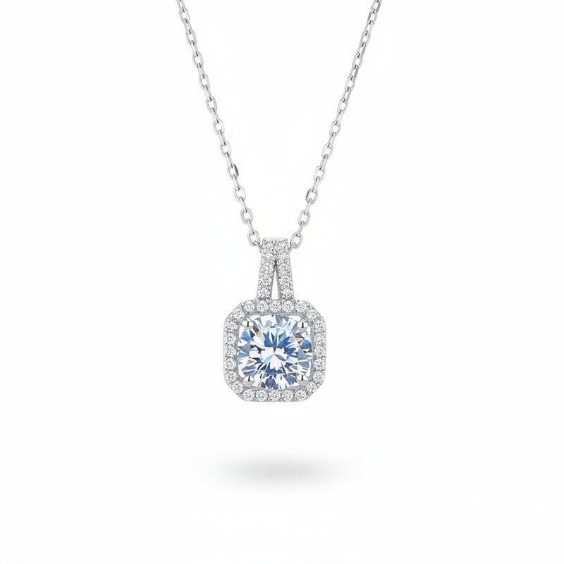 Cushion-cut moissanite pendant with halo accents on a silver chain