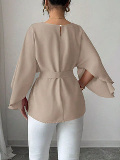 Beige batwing sleeve belted blouse with square buckle waist, back view