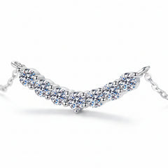 925 sterling silver moissanite necklace with visible round stones and prong settings