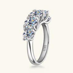 925 sterling silver moissanite ring with prong-set round clear stones and curved band