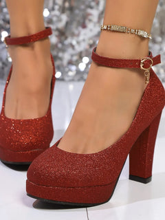 Red glitter platform pumps with pearl ankle strap, T-strap, and thick block heel