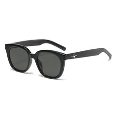 Black UV-protection sunglasses with dark lenses and star detail on temples