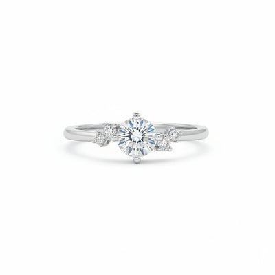 Sterling silver solitaire ring with round moissanite center and four side stones
