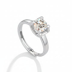 Sterling silver ring side view with round moissanite in four-prong setting