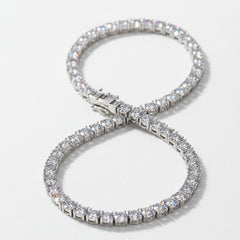Silver moissanite bracelet with pavé round stones, curved with clasp detail