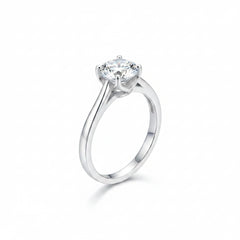 Sterling silver ring with round moissanite and four-prong crown detail