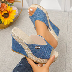 Blue peep-toe wedge sandals with textured fabric straps and braided jute sole