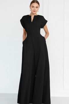 Black plus size jumpsuit with notched V-neck and flowy wide-leg legs, short sleeves.