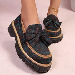 Plaid chunky loafers with front bow, dark teal plaid upper and thick black sole