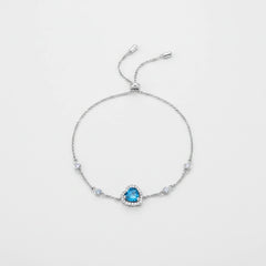 925 sterling silver bracelet with blue heart gemstone and round crystal accent stones