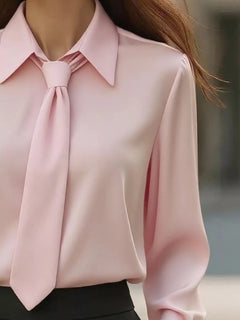 Pink collared long-sleeve blouse with neck tie and draped fit