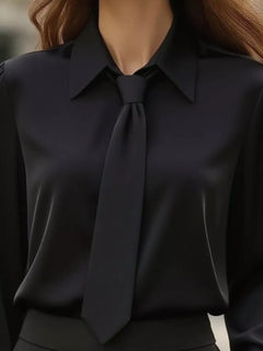 Black blouse with pointed collar and neck tie bow, long sleeves