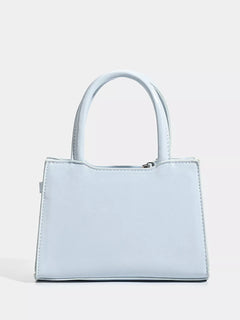 Light blue top-handle handbag with wide handles and simple front panel