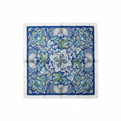 Blue silk scarf square with intricate white and green floral and leaf pattern