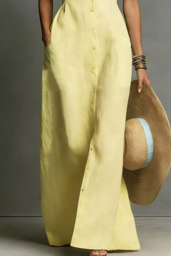 Pastel yellow sleeveless button-down maxi dress with front button placket and maxi length