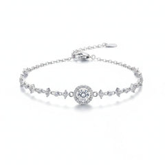Silver moissanite tennis bracelet with round center stone and zigzag pavé links