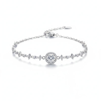 Silver moissanite tennis bracelet with round center stone and zigzag pavé links