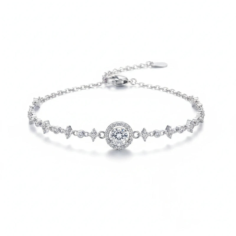 Silver moissanite tennis bracelet with round center stone and zigzag pavé links