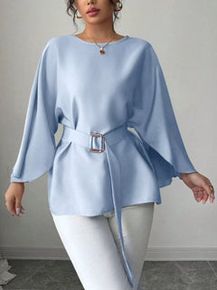 Light blue batwing sleeve belted blouse with square buckle at waist, relaxed peplum hem