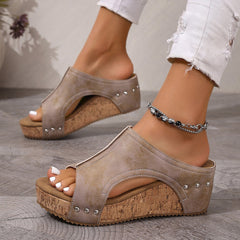 Khaki open-toe wedge sandals with stud trim, cork-look sole, and beaded ankle bracelet