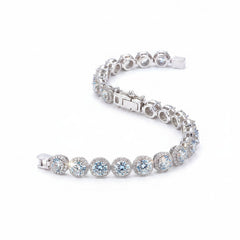Sterling silver moissanite bracelet with blue-toned round stones and box clasp