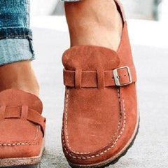 Suede round-toe low-heel loafer with buckle strap and stitched vamp, side view