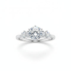 Sterling silver moissanite three-stone ring with round center stone and side stones, prong set