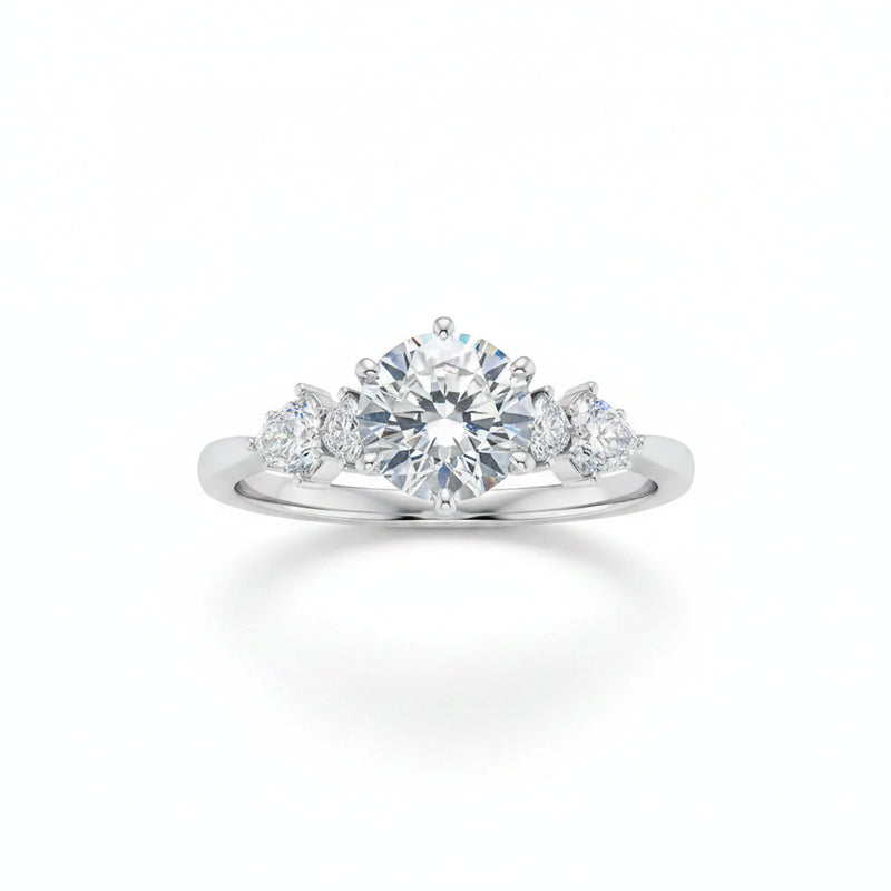 Sterling silver moissanite three-stone ring with round center stone and side stones, prong set
