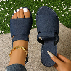 Denim-blue open toe flat sandals with ankle strap and textured footbed