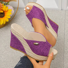 Purple peep-toe wedge sandals with braided jute platform and textured straps