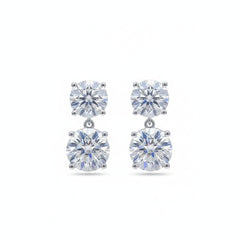Sterling silver moissanite drop earrings with two dangling round stones and prong settings
