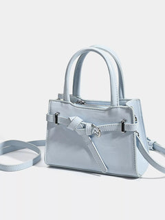 Light blue top-handle handbag with buckle detail and adjustable shoulder strap