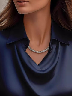Dark blue satin cowl-neck blouse with pointed collar and V drape, long sleeves