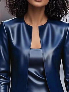 Blue leather open-front jacket close-up with V neckline and stitched seams