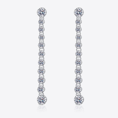 Silver drop earrings with round moissanite stones in a line