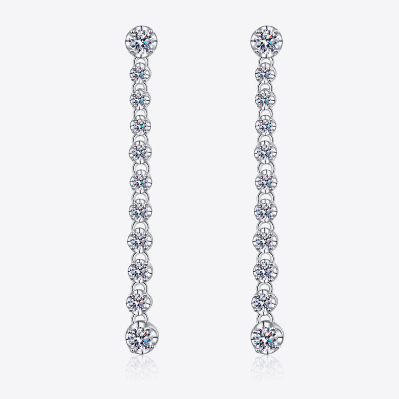 Silver drop earrings with round moissanite stones in a line