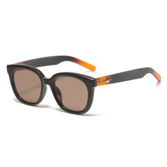 Brown UV-protection sunglasses with amber temples, star detail, tinted lenses