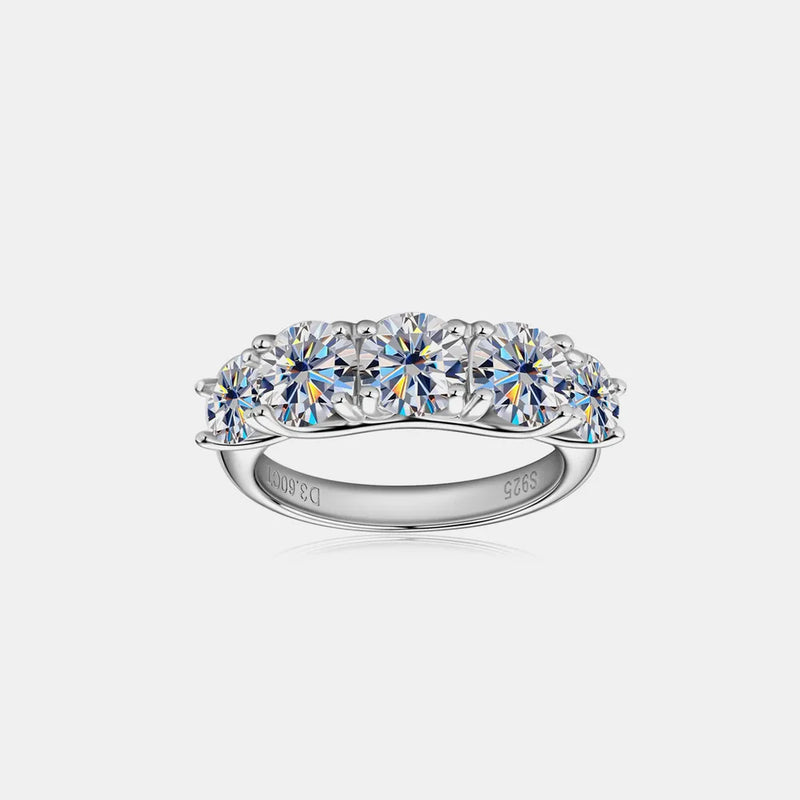 925 sterling silver moissanite band with a row of round clear stones