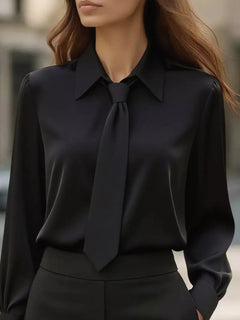Black collared long-sleeve blouse with neck tie bow