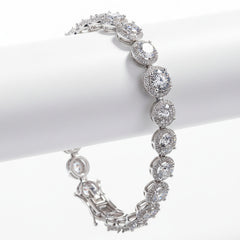 Sterling silver moissanite bracelet with round bezel-set stones and hinged clasp