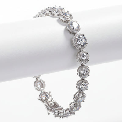 Sterling silver moissanite bracelet with round bezel-set stones and hinged clasp
